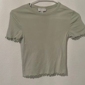 Light green ruffled top